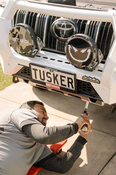 Rajitha from Automart Adelaide working on a vehicle accessories installation