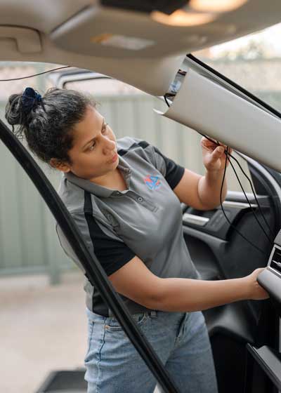 Shyama from Automart Adelaide working on a vehicle accessories installation